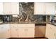 Beautiful kitchen featuring granite countertops, stainless steel appliances, and a modern design at 3436 N Tenaya Way, Las Vegas, NV 89129