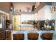 Stylish kitchen featuring granite countertops, white cabinets, and stainless steel appliances at 3436 N Tenaya Way, Las Vegas, NV 89129