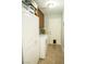 Clean and organized laundry room featuring plenty of storage space and a convenient pet door at 3436 N Tenaya Way, Las Vegas, NV 89129