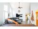 Open living room featuring high ceilings, large windows, a sectional sofa, and stylish furnishings at 3436 N Tenaya Way, Las Vegas, NV 89129