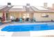 A refreshing pool in backyard offering ample space for outdoor enjoyment and desert landscaping at 3436 N Tenaya Way, Las Vegas, NV 89129