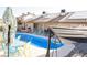 Sparkling pool with desert landscaping, complemented by cozy seating areas and ample space for relaxation at 3436 N Tenaya Way, Las Vegas, NV 89129