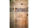 Close-up of the shower with tile and shampoo niche at 3436 N Tenaya Way, Las Vegas, NV 89129