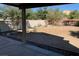 View of the backyard with a large patio area ready for outdoor entertaining at 3728 Prairie Orchid Ave, North Las Vegas, NV 89081