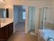 Bathroom featuring tile flooring, walk in shower and double sink vanity at 3728 Prairie Orchid Ave, North Las Vegas, NV 89081