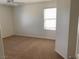 Bedroom featuring neutral carpet and a window for natural light, a serene and inviting space at 3728 Prairie Orchid Ave, North Las Vegas, NV 89081
