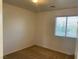 Bedroom featuring neutral carpet, white walls, and a window for natural light, ready for personalization at 3728 Prairie Orchid Ave, North Las Vegas, NV 89081