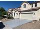 Two-story home features a two car garage, desert landscaping, and neutral paint scheme at 3728 Prairie Orchid Ave, North Las Vegas, NV 89081