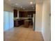 Spacious kitchen features stainless steel appliances, dark cabinetry, and an island at 3728 Prairie Orchid Ave, North Las Vegas, NV 89081