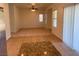 Large living room features tile floors, high ceilings, ceiling fan and large windows at 3728 Prairie Orchid Ave, North Las Vegas, NV 89081