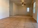 Large living room features tile floors, and multiple windows at 3728 Prairie Orchid Ave, North Las Vegas, NV 89081