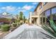 Scenic backyard featuring a spacious patio, mature landscaping, and rock accents at 3728 White Lion Ln, North Las Vegas, NV 89084