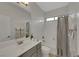 Bright bathroom with tub/shower combination, white vanity, and neutral paint at 3728 White Lion Ln, North Las Vegas, NV 89084