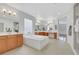 Spacious bathroom with soaking tub, double vanities, and tiled floors at 3728 White Lion Ln, North Las Vegas, NV 89084