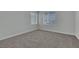 Bedroom with neutral carpet, window with blinds, and closet at 3728 White Lion Ln, North Las Vegas, NV 89084
