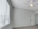 Bedroom with neutral carpet, window with blinds, ceiling fan, and neutral paint at 3728 White Lion Ln, North Las Vegas, NV 89084