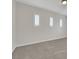 Neutral bedroom offers carpeted floors and windows with shutters at 3728 White Lion Ln, North Las Vegas, NV 89084