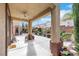 Inviting covered patio with ceiling fan and access to backyard at 3728 White Lion Ln, North Las Vegas, NV 89084