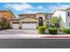 Beautiful two-story home with a three-car garage and well-maintained landscaping at 3728 White Lion Ln, North Las Vegas, NV 89084