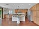 Bright kitchen with granite countertops, stainless steel appliances, and a central island at 3728 White Lion Ln, North Las Vegas, NV 89084