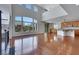Spacious living area with high ceilings, open to the kitchen, and backyard views through large windows at 3728 White Lion Ln, North Las Vegas, NV 89084