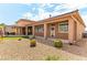 Large backyard with covered patio and rock landscaping at 3811 Queen Elizabeth Ct, Laughlin, NV 89029