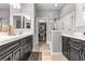 An elegant bathroom features a dual-sink vanity, a glass-enclosed shower, and a walk-in closet at 3811 Queen Elizabeth Ct, Laughlin, NV 89029