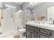 Bathroom with a modern shower, frosted glass, and neutral vanity at 3811 Queen Elizabeth Ct, Laughlin, NV 89029