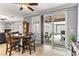 Open dining area with natural light, stylish furniture, and sliding doors to the outdoor patio at 3811 Queen Elizabeth Ct, Laughlin, NV 89029
