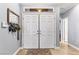 Welcoming entryway with double doors, transom window, and stylish tile flooring at 3811 Queen Elizabeth Ct, Laughlin, NV 89029