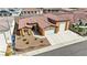 Inviting curb appeal with landscaped front yard leading to a well-maintained home with a three-car garage at 3811 Queen Elizabeth Ct, Laughlin, NV 89029