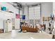 Living room conversion of the garage showcasing retro decor, a seating area, and wall art at 3811 Queen Elizabeth Ct, Laughlin, NV 89029
