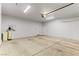 Open garage space with bright lighting and door to the house for easy access at 3811 Queen Elizabeth Ct, Laughlin, NV 89029