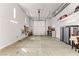 Well-lit garage with high ceilings, storage shelves, and an organized workspace at 3811 Queen Elizabeth Ct, Laughlin, NV 89029