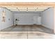 Spacious garage with ample room for parking and storage; features neutral-colored walls at 3811 Queen Elizabeth Ct, Laughlin, NV 89029