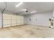 Garage featuring large door, overhead lighting, and utility connections at 3811 Queen Elizabeth Ct, Laughlin, NV 89029