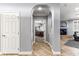 Hallway view with archway leading to bedroom and sightline to living room fireplace at 3811 Queen Elizabeth Ct, Laughlin, NV 89029