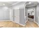 Hallway featuring tile floors and white trim with an arched opening at 3811 Queen Elizabeth Ct, Laughlin, NV 89029