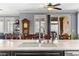 Spacious kitchen featuring stone countertops and a sink overlooking the dining area at 3811 Queen Elizabeth Ct, Laughlin, NV 89029