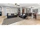 Large living room showcasing a fireplace, and comfortable seating with a ceiling fan at 3811 Queen Elizabeth Ct, Laughlin, NV 89029