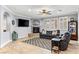Well-lit living room featuring comfortable seating, a fireplace, and tile flooring throughout at 3811 Queen Elizabeth Ct, Laughlin, NV 89029