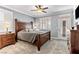 Inviting main bedroom showcasing plantation shutters and a wooden bed frame at 3811 Queen Elizabeth Ct, Laughlin, NV 89029
