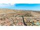 Scenic aerial view of a residential community with mountain views under a clear blue sky at 3811 Queen Elizabeth Ct, Laughlin, NV 89029