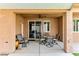 Covered patio featuring comfortable seating and ceiling fan for relaxing outdoor living at 3811 Queen Elizabeth Ct, Laughlin, NV 89029