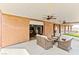 Covered patio with comfortable wicker furniture and direct access to the garage at 3811 Queen Elizabeth Ct, Laughlin, NV 89029