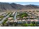 Mountain community with single Gathering homes, lush trees and desert landscape at 4016 Owlshead Mountain St, Las Vegas, NV 89129