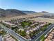Community aerial view with mountain backdrop and desert landscaping at 4016 Owlshead Mountain St, Las Vegas, NV 89129