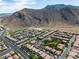 A captivating aerial view of a Las Vegas community near the picturesque Trigono Hills Park at 4016 Owlshead Mountain St, Las Vegas, NV 89129