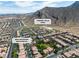An aerial view showcases a Las Vegas neighborhood near the scenic Trigono Hills Park at 4016 Owlshead Mountain St, Las Vegas, NV 89129