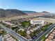 Community aerial shot features mountain views, desert, and street address at 4016 Owlshead Mountain St, Las Vegas, NV 89129